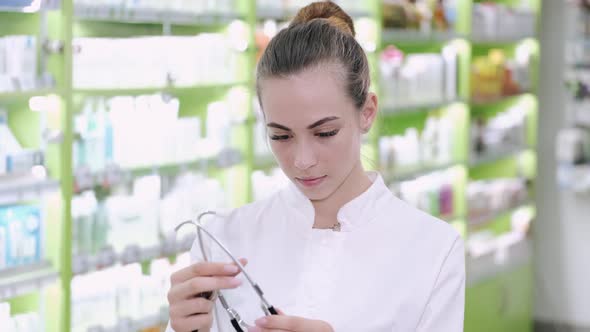 Female Nurse Preparing for Blood Pressure Checking alt