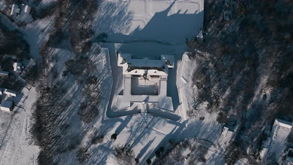 Top Down Aerial View Drone Flight Over the Historic Old Castle at Sunny Winter Day Pidhirtsi Palace alt