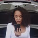 Young woman calling to mechanic with smartphone while car trouble and breakdown with angry. - VideoHive Item for Sale