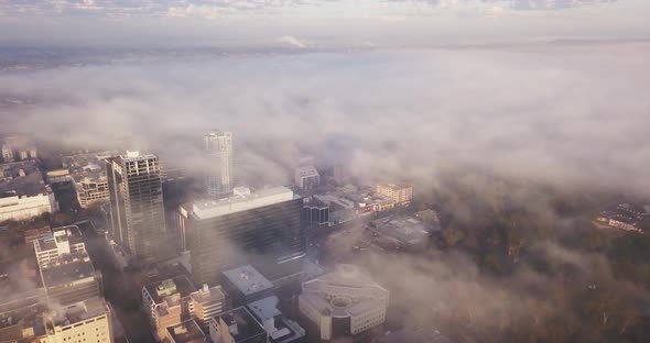 Flying Over The City on a Foggy Morning alt