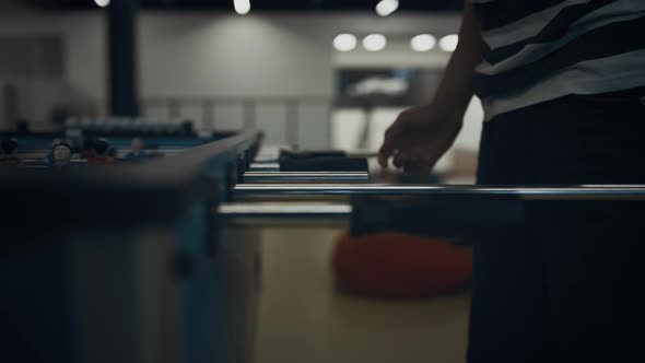 Energetic Boy Hands Playing Table Football Close Up alt