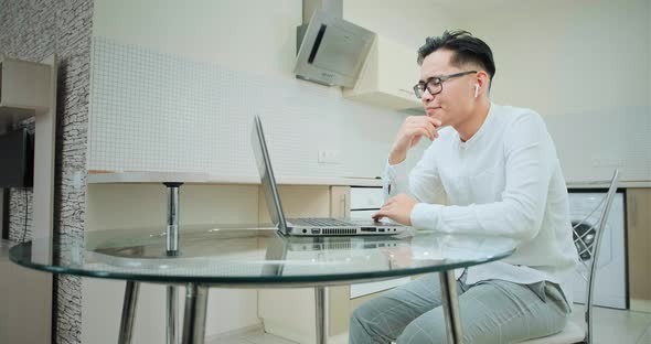 Thoughtful Manager in Headphones Listens To Colleague alt