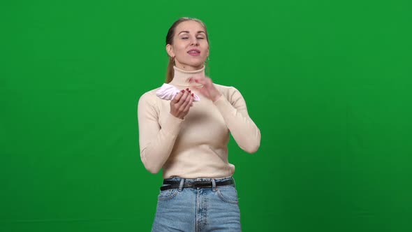 Slim Woman Putting Sock in Bra to Make Breasts Bigger alt