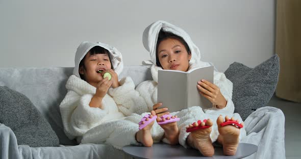 Two Asian Girls of Different Generations in Bathrobes Mother and Daughter Relax After Shower on alt