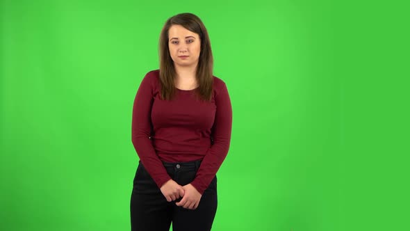 Pretty Girl Worrying in Expectation Then Guilty Hides Her Eyes. Green Screen alt