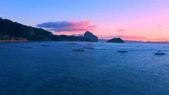 Sail Boats at Sunset on the Sea Lagoon on Corong Beach in El Nido, Palawan, Philippines alt