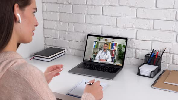 Patient at home talk consults doctor online conference video call laptop webcam alt