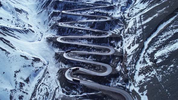 Winding highway road with curves winding road at Andes Mountains. alt