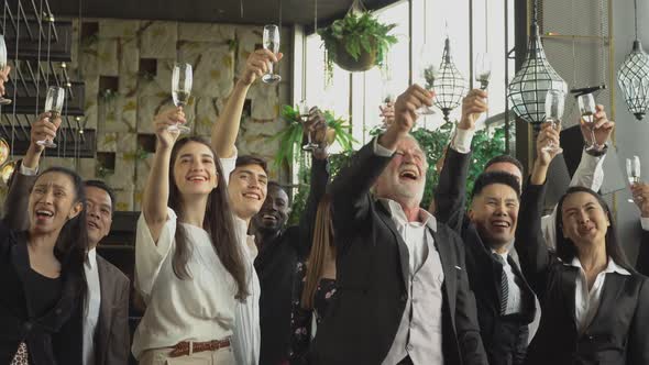 Group of business people toasting champagne to celebrate on New Year