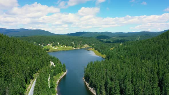Aerial View of Landscape with Mountains, Forest and Lake