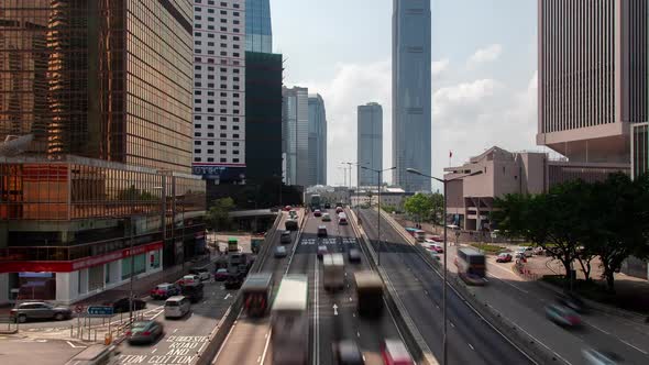 Timelapse Cars Drive Along Hong Kong Road Under Cloudy Sky alt