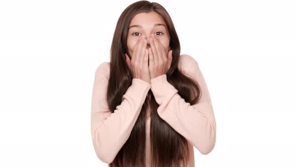 Portrait of Young Woman 20s Expressing Surprise and Excitement Covering Open Mouth with Hands Can't alt