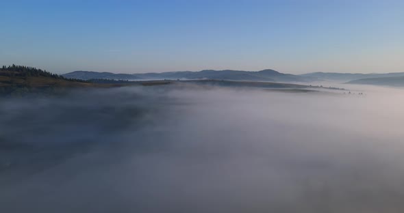 Thick Fog Covered The High Mountains. Dawn In The Carpathians