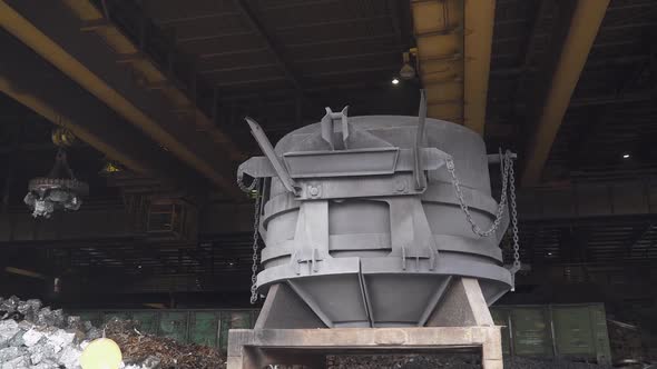 Steelmaking the Process of Loading Scrap Metal Into a Tank for Steel Melting Gantry Cranes with alt