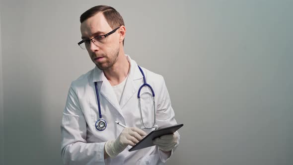 Doctor Using Tablet