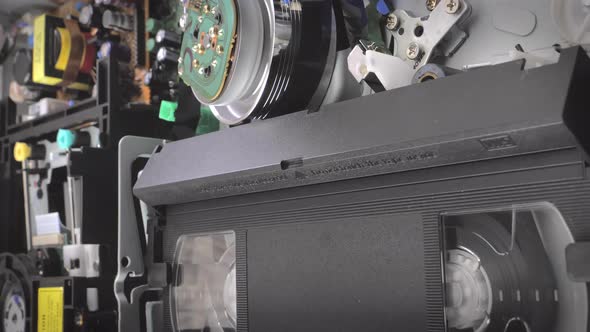 Closeup Shot Showing Inside of a Vcr While a Vhs Cassette is Being Removed
