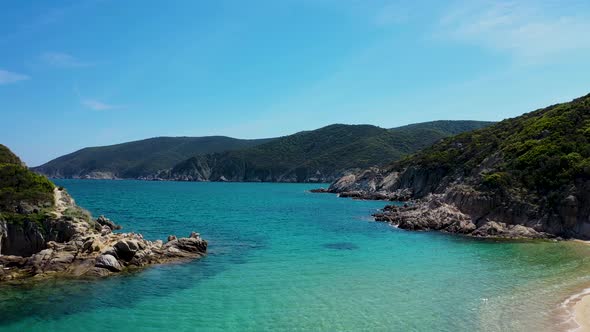 Turquoise sea and a beach with amazing island view in the Mediterranean with crystal clear water and alt
