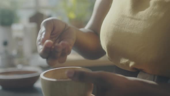 Female Food Blogger Preparing Ingredients for Pesto alt