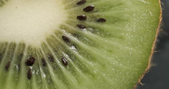 Sliced kiwi rotating close up