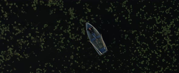 A Boat Is Floating on Dark Water
