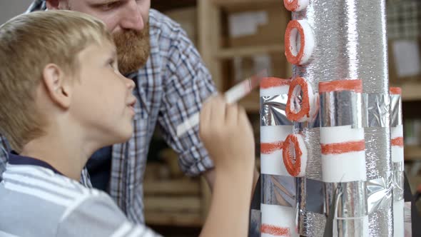 Boy Finishing Handicraft alt