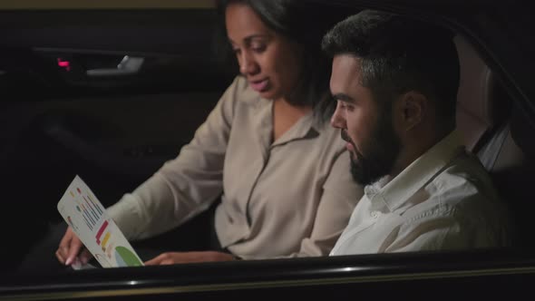 Man And Woman Discussing Business Plan alt