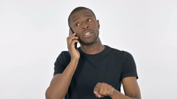 Young African Man Talking on Phone on White Background alt