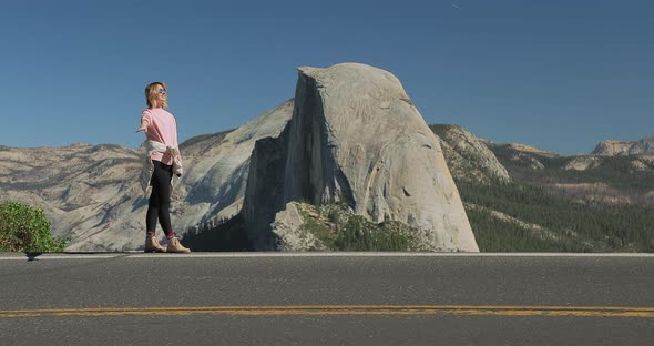Yosemite Valley USA, Slow Motion of Smiling Attractive Woman in Casual Clothing alt