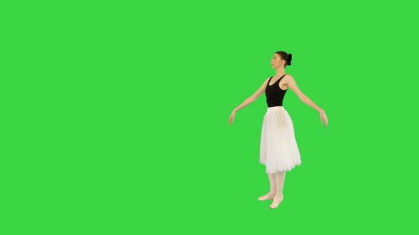 Young Beautiful Ballerina Walks Demipointe on a Green Screen Chroma Key