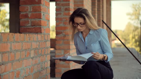 Civil Engineer Checking Construction Site. Woman Architect  Inspecting Real Estate Building.Designer alt