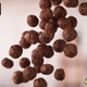 Handful of Falling Chocolate Ball-Shaped Cereals - VideoHive Item for Sale