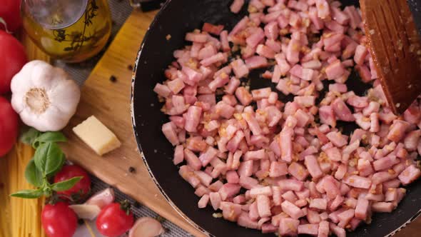 Making Pasta Carbonara  Mixing Chopped Pancetta Bacon in Frying Pan alt