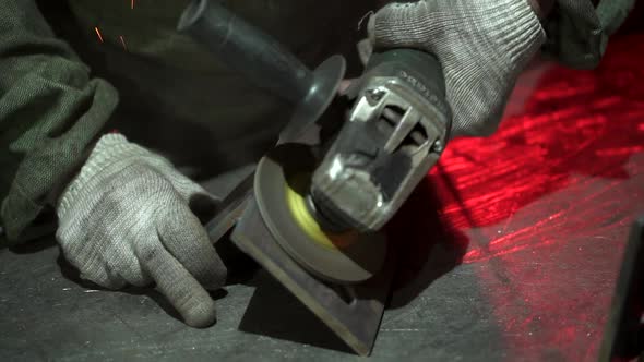 Hand Man Work Wearing Gloves While Grinding Metal