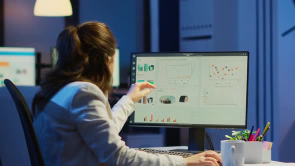 Manager Woman Working Late at Night in Business Office for Deadline alt