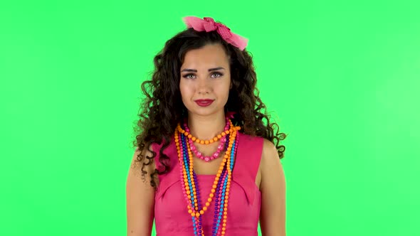 Young Woman Standing, Spreads Out in a Smile and Looks at the Camera. Green Screen alt