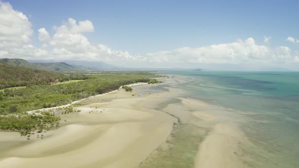 Aerial, Low Tide And Huge Sand Ocean Bed And Mangroves Growing In Queensland Australia