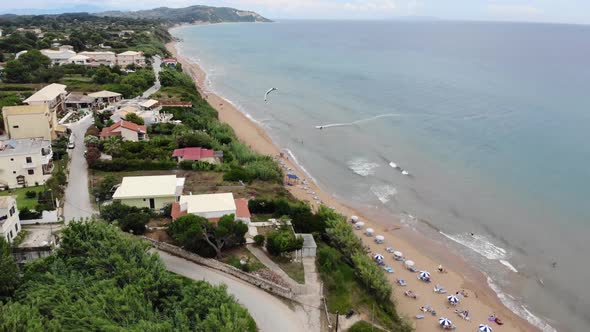 Aerial footage at beautiful small town of St George South in the city of Corfu Greece alt