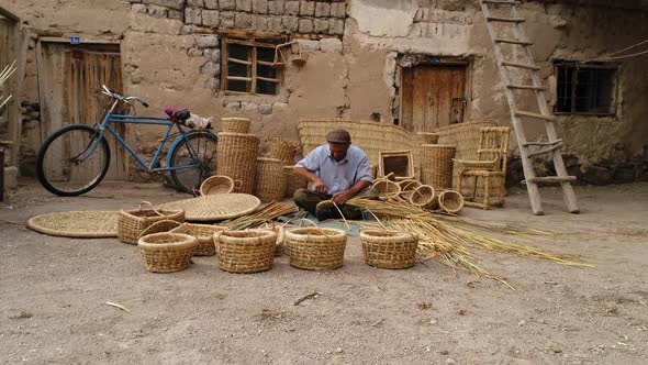 Old Man Making A Bamboo Basket alt