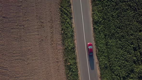 Moving Car, aerial. Aerial shot of a moving car on the countryside highway.