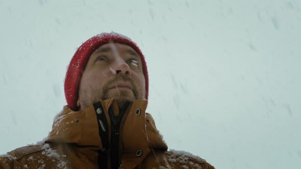 Portrait of a Man in Snowfall