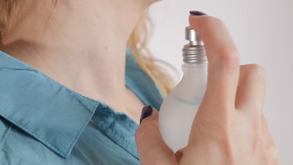 Woman spraying fragrance on neck slow motion 1920X1080 FullHD video - Female applying pefume on neck