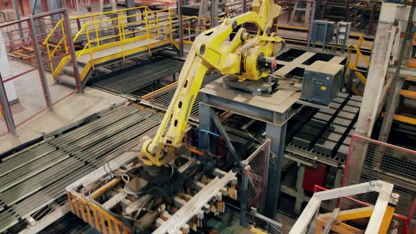 Modern Automated Mechanical Arm Is Moving at the Factory Unit. Industrial Revolution 4.0 alt