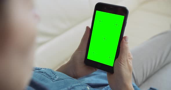 Woman Holding Greenscreen Smartphone