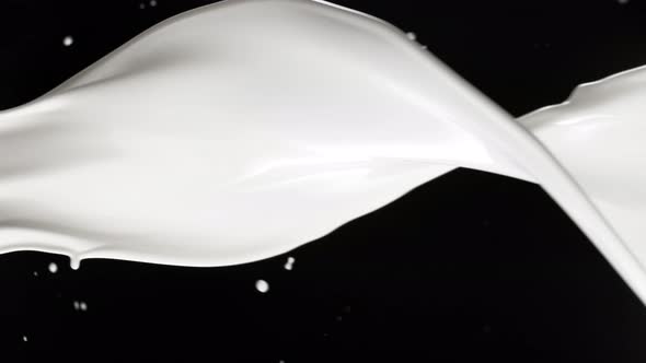 Super Slow Motion Shot of Milk Spiral Splash Isolated on Black Background at 1000 Fps alt