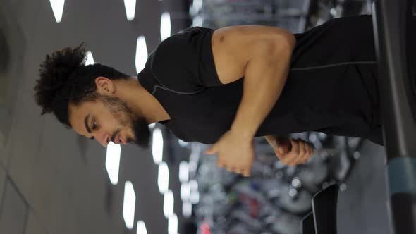 Fitness Man Training Cardio Exercise on Running Machine in Gym alt