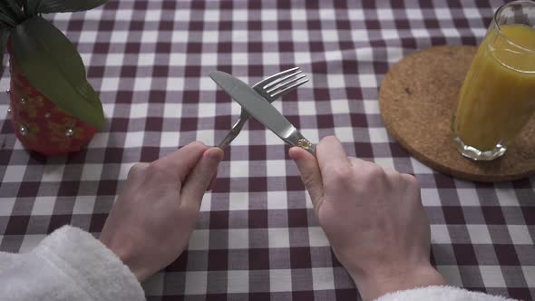 Man's Hand Rub the Knife on the Fork, Demanding Food alt