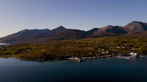 Picturesque View Of The Mountains And Coastal Island Of Senja In Norway - aerial shot alt