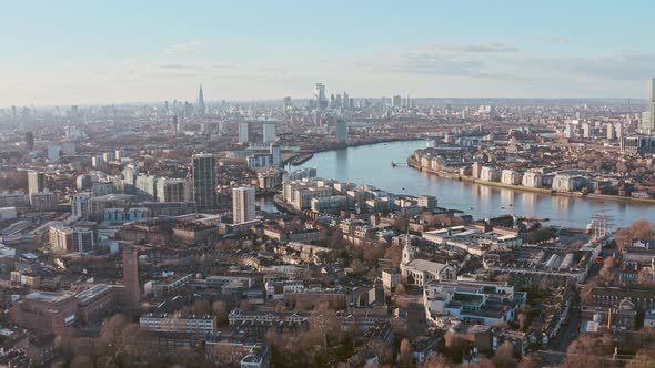 Drone shot towards central London skyline from Greenwich at sunset alt