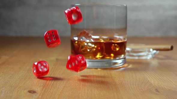 Whiskey in Highball on a Wooden Table and Dice