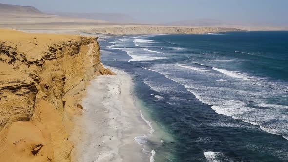 waves on sea and high cliffs in Paracas National Reserve. coast of Ica, Peru. wide shot alt